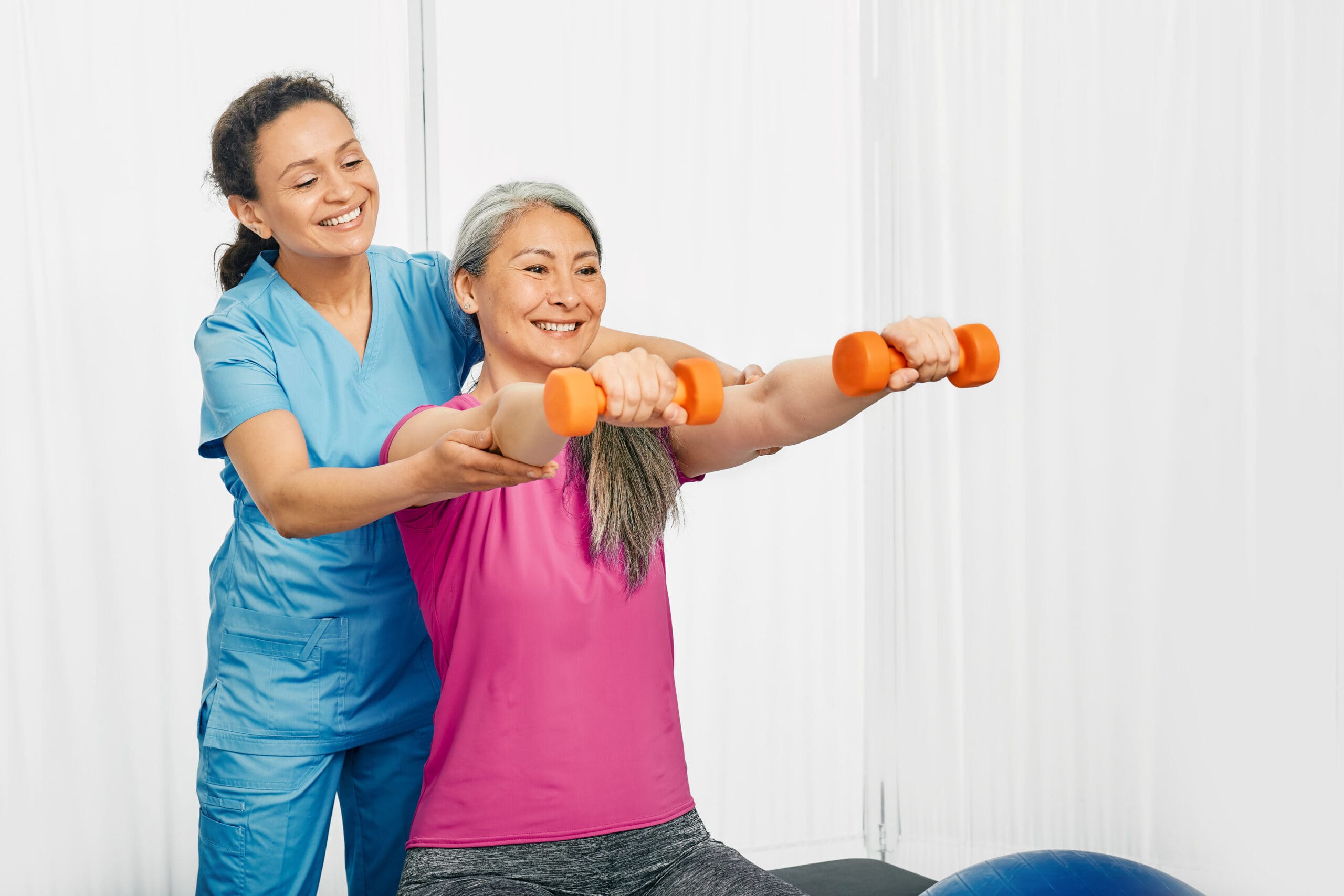 Physiotherapist guiding a patient through exercise